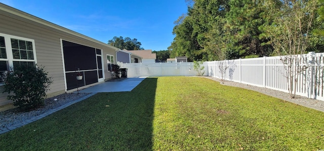 view of yard featuring a sunroom