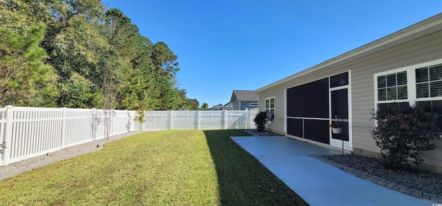 view of yard with a sunroom