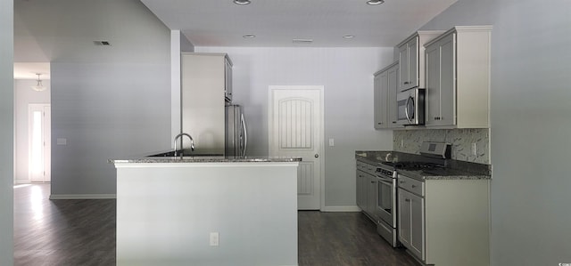 kitchen featuring dark wood-type flooring, gray cabinetry, and appliances with stainless steel finishes