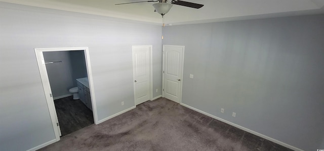 unfurnished bedroom with carpet, ceiling fan, and ensuite bath