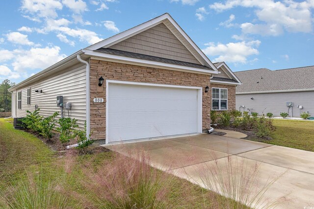 view of side of home with a garage