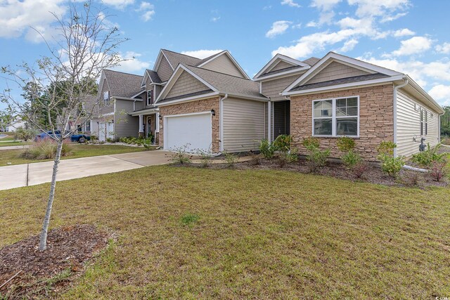 craftsman house featuring a front yard and a garage