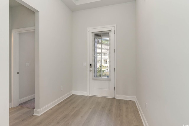 doorway to outside with light hardwood / wood-style flooring