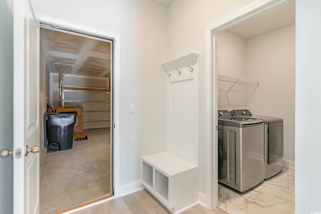 mudroom with washing machine and clothes dryer