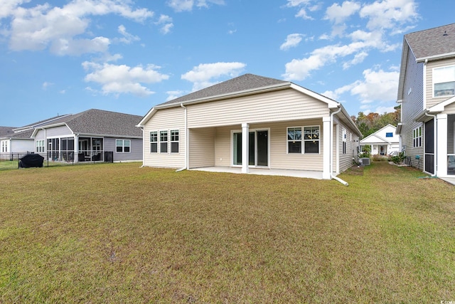 back of property featuring a yard and a patio