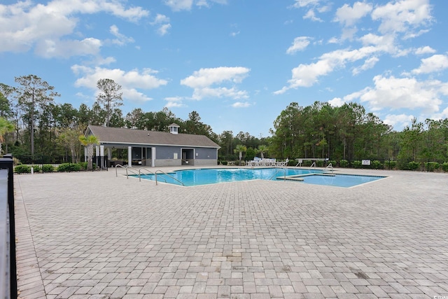 view of pool featuring a patio