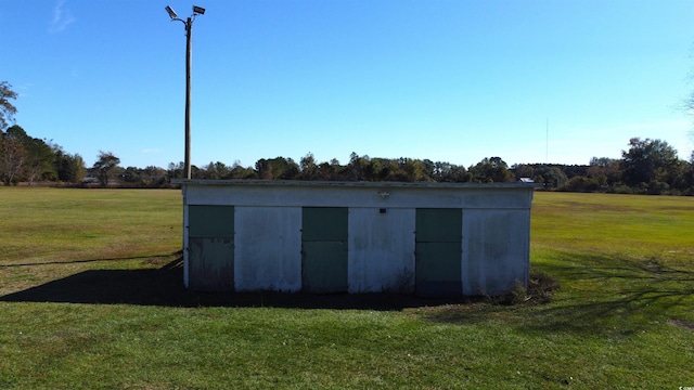 view of outdoor structure with a yard