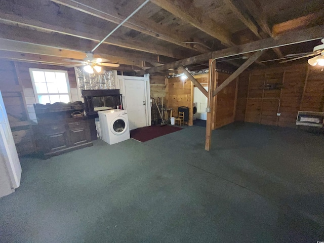 basement with ceiling fan and washer / clothes dryer