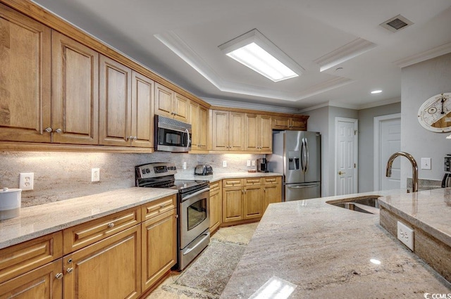 8500 Margate Cir Unit 2704, Myrtle Beach, SC 29572 - kitchen featuring appliances with stainless steel finishes, a sink, light stone counters, ornamental molding, and decorative backsplash