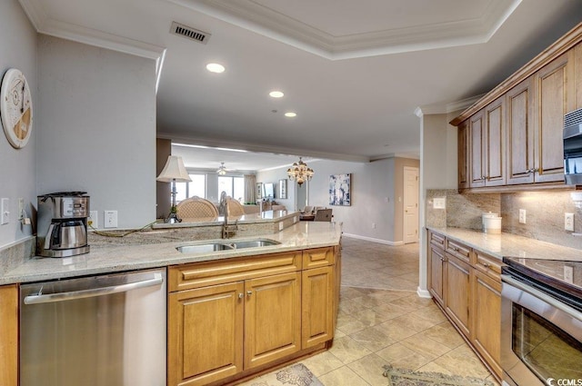 8500 Margate Cir Unit 2704, Myrtle Beach, SC 29572 - kitchen featuring appliances with stainless steel finishes, a sink, a peninsula, backsplash, and crown molding