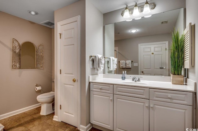 8500 Margate Cir Unit 2704, Myrtle Beach, SC 29572 - bathroom featuring baseboards, vanity, toilet, and tile patterned flooring