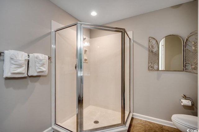 8500 Margate Cir Unit 2704, Myrtle Beach, SC 29572 - full bathroom featuring a shower stall, baseboards, and toilet