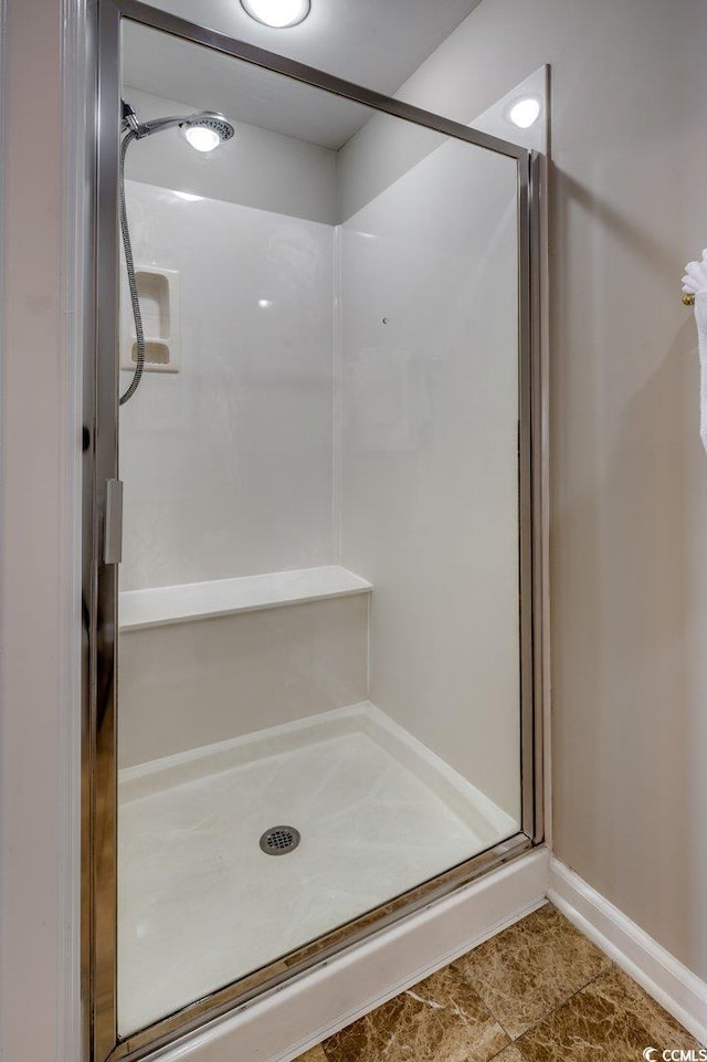 8500 Margate Cir Unit 2704, Myrtle Beach, SC 29572 - bathroom featuring a stall shower and baseboards