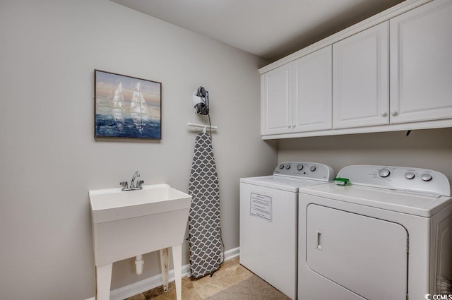 8500 Margate Cir Unit 2704, Myrtle Beach, SC 29572 - laundry room with cabinet space, washer and clothes dryer, and baseboards