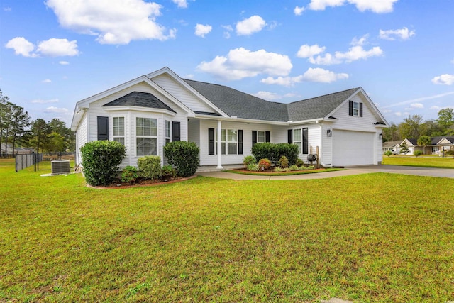 ranch-style home with a garage, a front lawn, and cooling unit