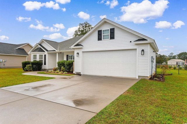 view of front facade with a front yard and a garage