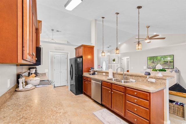 kitchen featuring ceiling fan, sink, dishwasher, hanging light fixtures, and black fridge