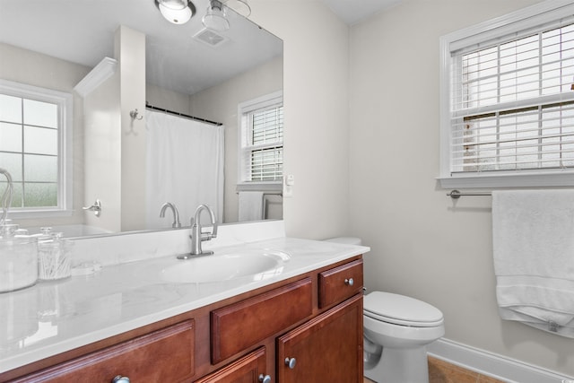 bathroom with tile patterned floors, vanity, and toilet