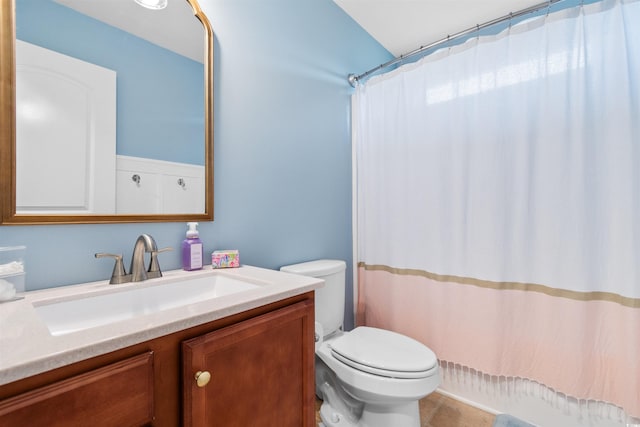 full bathroom with tile patterned floors, vanity, toilet, and shower / bath combo