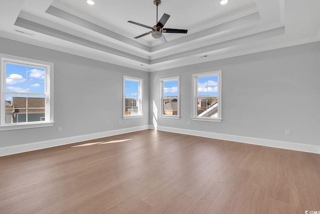 unfurnished room with light hardwood / wood-style floors, plenty of natural light, and crown molding