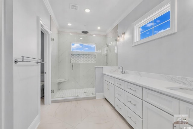 bathroom with vanity, toilet, a shower with door, and crown molding