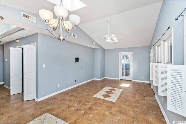 interior space with ceiling fan with notable chandelier and vaulted ceiling