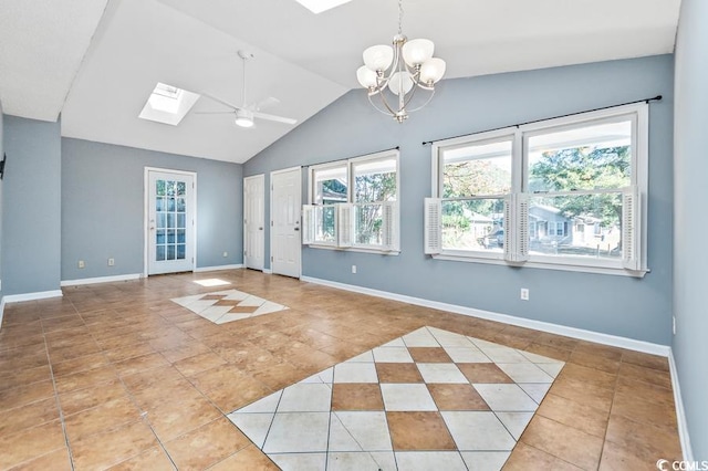 unfurnished room with ceiling fan with notable chandelier, light tile patterned floors, and lofted ceiling with skylight