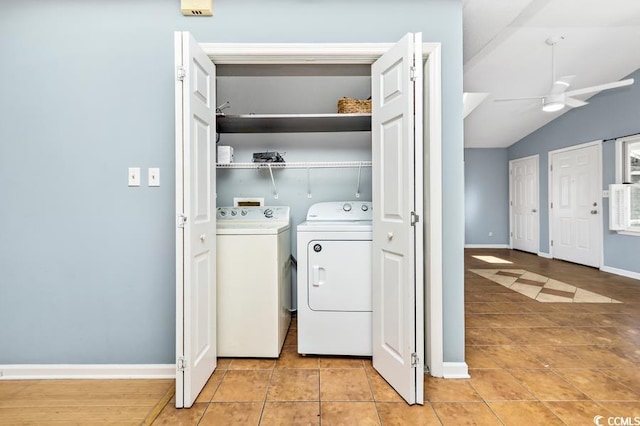 laundry room with ceiling fan, light tile patterned floors, and washing machine and clothes dryer