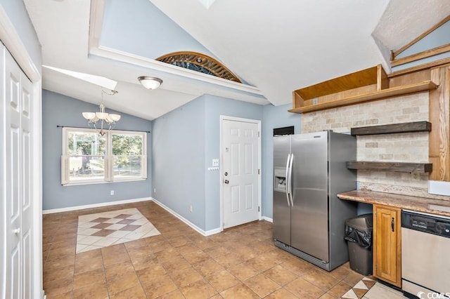 kitchen featuring lofted ceiling, light tile patterned flooring, a notable chandelier, and appliances with stainless steel finishes