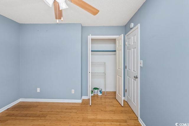 unfurnished bedroom featuring ceiling fan and light wood-type flooring