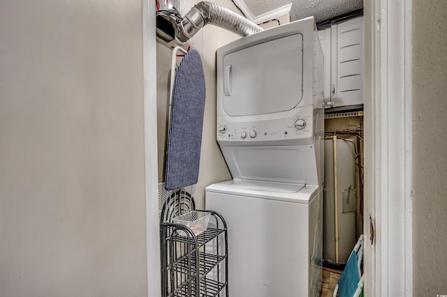 814 N Waccamaw Dr Unit 311, Garden City Beach, SC 29576 - washroom with stacked washer / drying machine and water heater