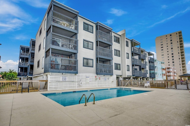 814 N Waccamaw Dr Unit 311, Garden City Beach, SC 29576 - community pool featuring a patio