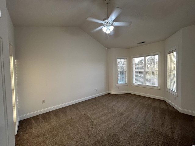 carpeted spare room with lofted ceiling and ceiling fan