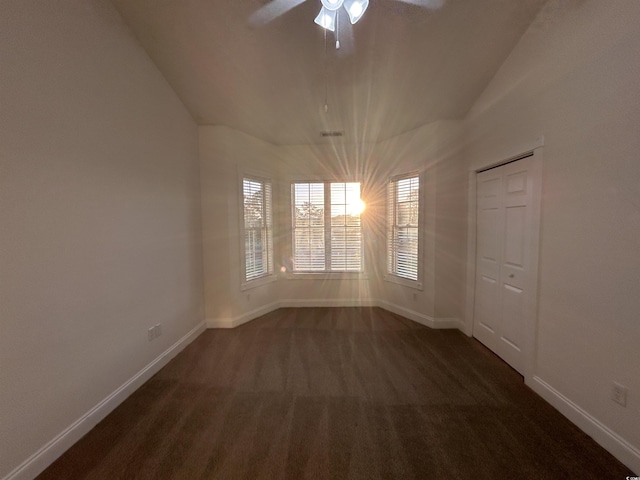 carpeted empty room featuring ceiling fan