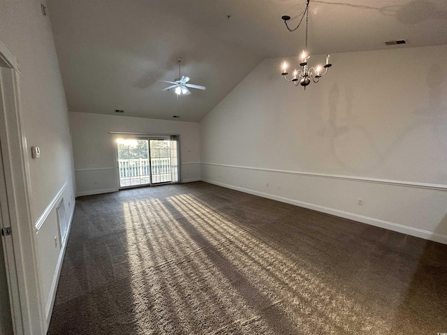 empty room with ceiling fan with notable chandelier, high vaulted ceiling, and dark carpet