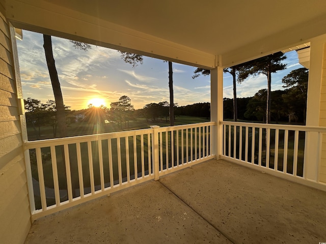 view of balcony at dusk