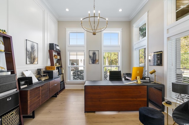 home office featuring a chandelier, a towering ceiling, light hardwood / wood-style floors, and crown molding