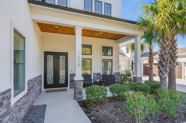 property entrance with french doors and a porch