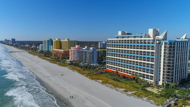 drone / aerial view featuring a view of the beach and a water view