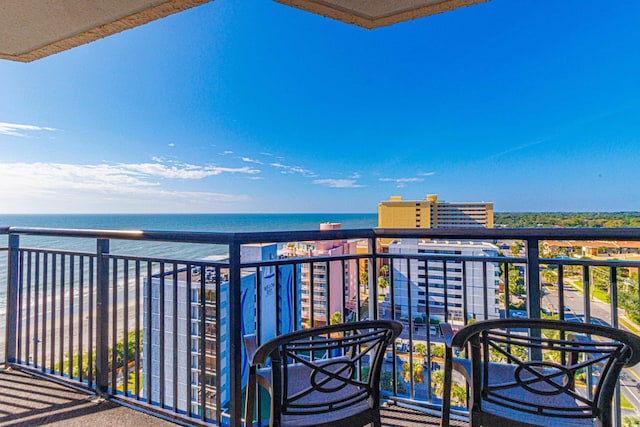 balcony featuring a water view