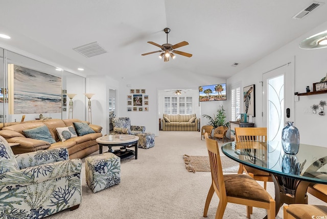 living room with carpet flooring, ceiling fan, and lofted ceiling