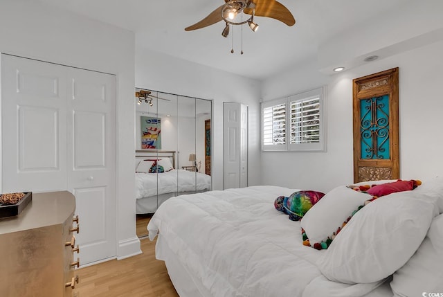 bedroom with light wood-type flooring and ceiling fan