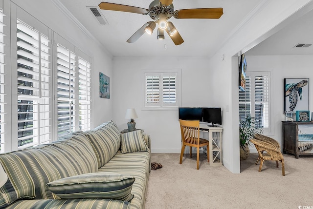 office space with ceiling fan, light colored carpet, and crown molding