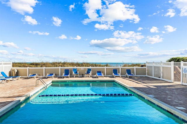 view of swimming pool with a patio