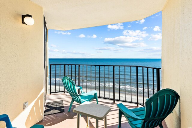 balcony featuring a water view