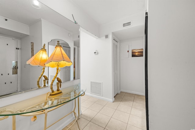 hall featuring light tile patterned floors