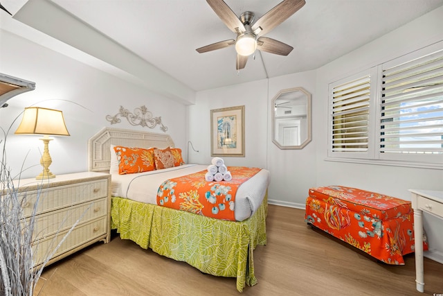 bedroom featuring wood-type flooring and ceiling fan