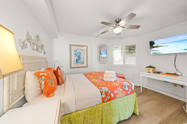 bedroom featuring hardwood / wood-style flooring and ceiling fan