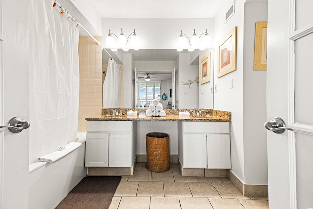 bathroom featuring ceiling fan, shower / bath combo, tile patterned floors, a textured ceiling, and vanity