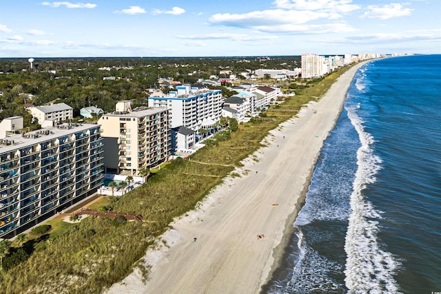 bird's eye view featuring a water view and a beach view